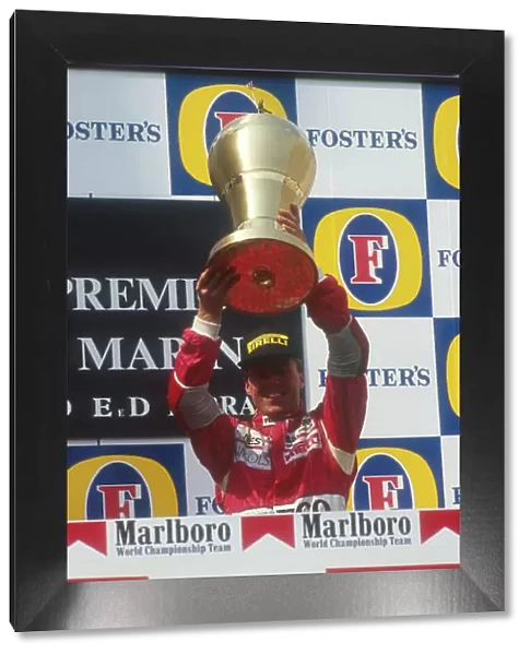 1991 San Marino Grand Prix. Imola, Italy. 26-28 April 1991. J.J. Lehto (Dallara Judd) celebrates 3rd position on the podium. Ref-91 SM 13. World Copyright - LAT Photographic