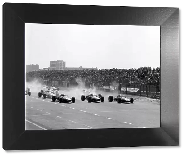 1966 Dutch Grand Prix. Zandvoort, Holland. 24 July 1966. Jack Brabham, Brabham BT19-Repco, 1st position, Denny Hulme, Brabham BT20-Repco, retired, and Jim Clark, Lotus 33-Climax, 3rd position, lead at the start
