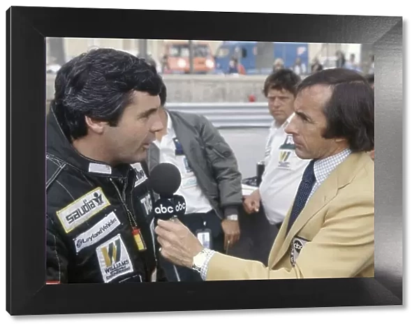 1981 Monaco Grand Prix. Monte Carlo, Monaco. 28-31 May 1981. Jackie Stewart interviews Alan Jones (Williams FW07C-Ford Cosworth) for ABC Television. Portrait. World Copyright: LAT Photographic Ref: 35mm transparency 81MON54