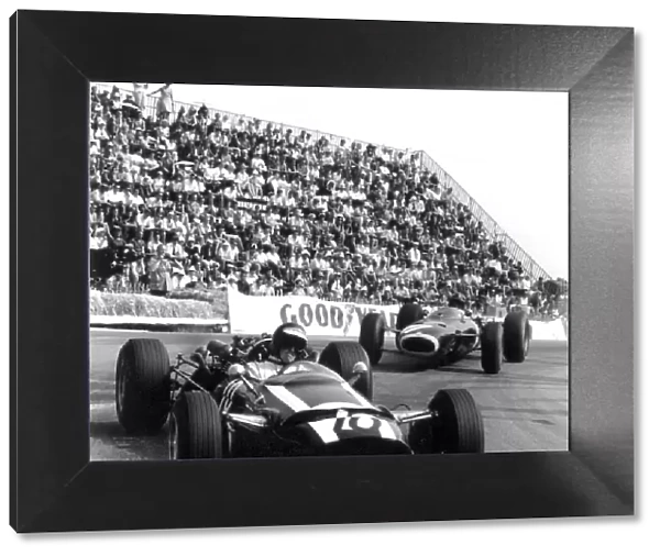 1966 Monaco Grand Prix. Monte Carlo, Monaco. 22 May 1966. Jochen Rindt, Cooper T81-Maserati, retired, leads Graham Hill, BRM P261, 3rd position, action. World Copyright: LAT Photographic Ref: 34097
