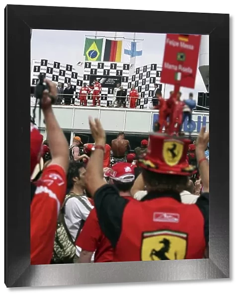 2006 German Grand Prix - Sunday Race Hockenheim, Germany. 27th - 30th July. Ferrari fans get a good view of the podium. World Copyright: Charles Coates / LAT Photographic ref: Digital Image ZK5Y2445