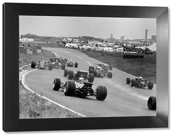 1968 Dutch Grand Prix. Zandvoort, Holland. 23 June 1968. Graham Hill, Lotus 49B-Ford, 9th position, leads at the start, action. World Copyright: LAT Photographic Ref: Motor b&w print