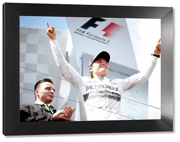 Red Bull Ring, Spielberg, Austria. Sunday 22 June 2014. Nico Rosberg, Mercedes AMG, 1st Position, on the podium. World Copyright: Glenn Dunbar / LAT Photographic. ref: Digital Image _W2Q2138