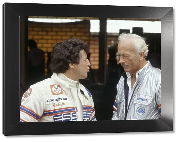 1980 South African Grand Prix. Kyalami, South Africa. 28 February-1 March 1980. Mario Andretti (Lotus 81-Ford Cosworth) with Essex Team Lotus owner Colin Chapman. Portrait. World Copyright: LAT Photographic Ref: 35mm transparency 80SA14