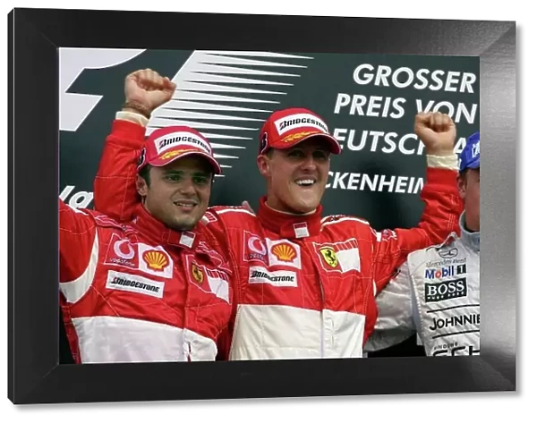 2006 German Grand Prix - Sunday Race Hockenheim, Germany. 27th - 30th July. Michael Schumacher (1st position), and Felipe Massa (2nd position) of Ferrari celebrate on the podium with Kimi Raikkonen (3rd position)