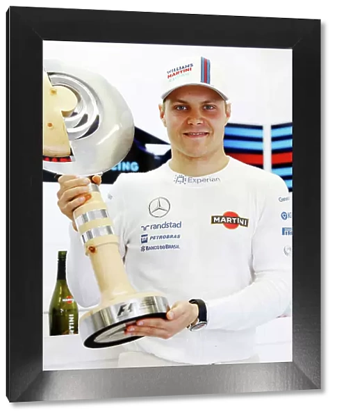 Red Bull Ring, Spielberg, Austria. Sunday 22 June 2014. Valterri Bottas, Williams F1, 3rd Position, with his trophy. World Copyright: Charles Coates / LAT Photographic. ref: Digital Image _N7T5146