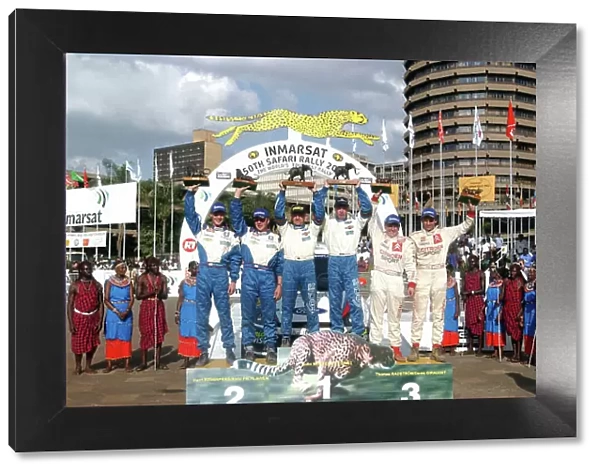 2002 World Rally Championship. Safari Rally, Nairobi Kenya, July 11-14th. The top three crews with their trophies. Photo: Ralph Hardwick / LAT