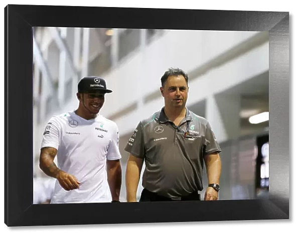 Marina Bay Circuit, Singapore. Friday 20th September 2013. Lewis Hamilton, Mercedes AMG walks in the paddock with Team Manager Ron Meadows. World Copyright: Charles Coates / LAT Photographic. ref: Digital Image _N7T3067