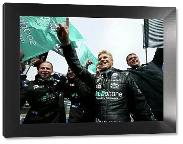 2007 FIA GT Championship. The Royal Automobile Club Tourist Trophy. Silverstone, England. 5th - 6th May 2007. Mika Salo (Maserati MC 12 GT1) celebrates victory with team members in the pits. Portrait. World Copyright
