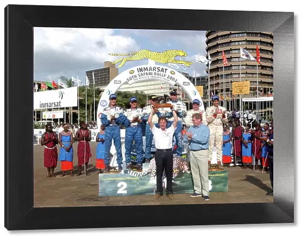 2002 World Rally Championship. Safari Rally, Nairobi Kenya, July 11-14th. Malcolm Wilson receves the manufacturers trophy. Photo: Ralph Hardwick / LAT