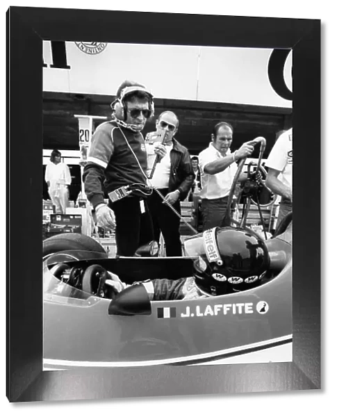 1980 Argentine Grand Prix. Buenos Aires, Argentina. 11-13 January 1980. Jaques Laffite (Ligier JS11 / 15-Ford), retired, talks to Gerard Ducarouge in the pit lane, portrait. World Copyright: LAT Photographic. Ref: B / W Print