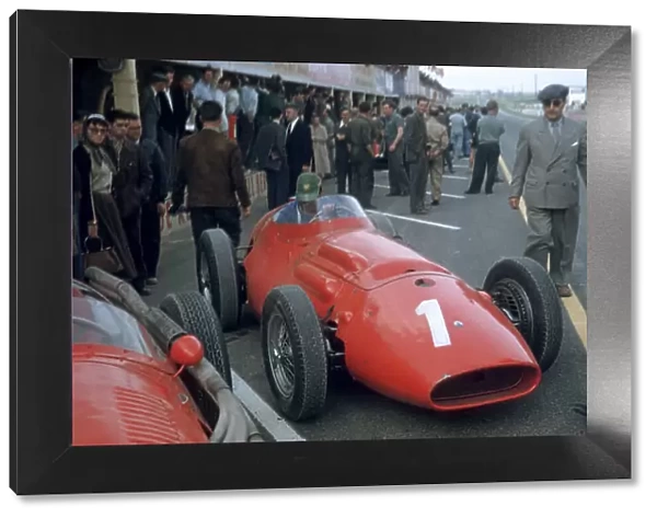 1956 French Grand Prix Reims, France. 29th June - 1st July. Maserati 250F Chassis no. 2501 is prepared in the pits as a crowd of people watch on. World Copyright: LAT Photographic ref: 56 FRA 16