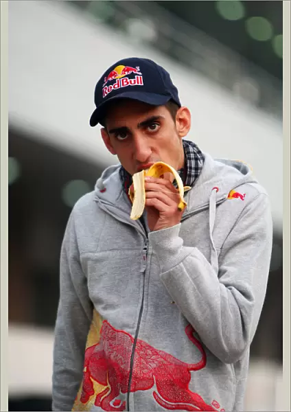 Formula One World Championship: Sebastien Buemi Scuderia Toro Rosso eats a banana