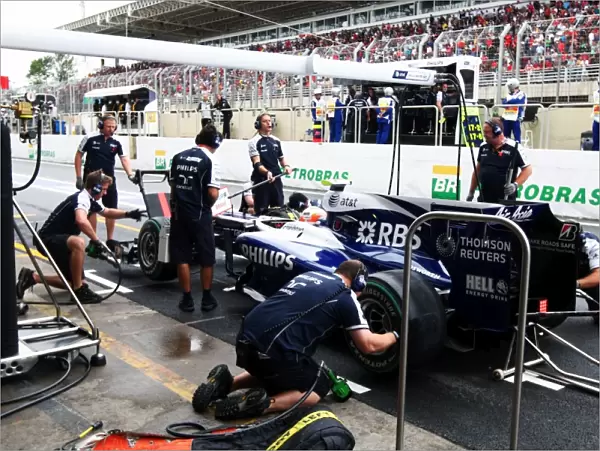 Formula One World Championship: Nico Hulkenberg Williams FW32 changes onto slick tyres en route to taking his first career pole position