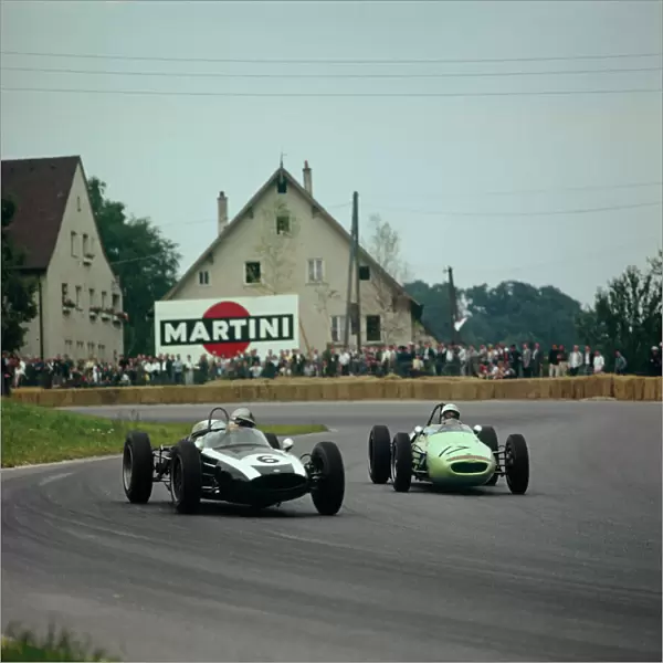 1961 Solitude Grand Prix: Stirling Moss, retired, chases Jack Brabham, 5th position, action
