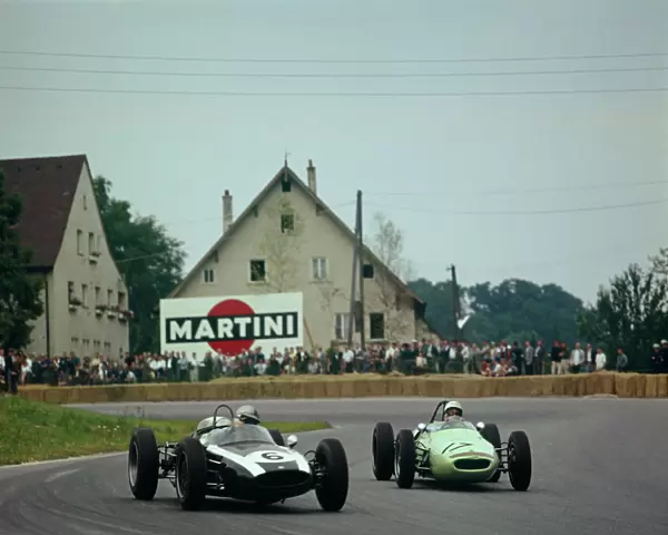 1961 Solitude Grand Prix: Stirling Moss, retired, chases Jack Brabham, 5th position, action