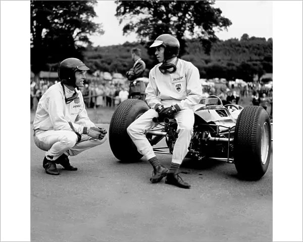 1964 Belgian Grand Prix - Dan Gurney and Jim Clark: Jim Clark talks to Dan Gurney