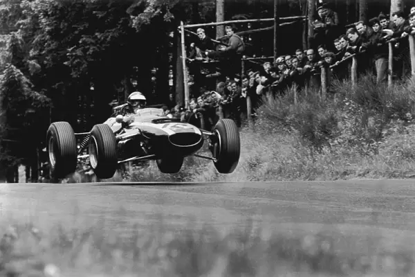 1965 German Grand Prix - Jochen Rindt: Jochen Rindt 4th position, jumping action