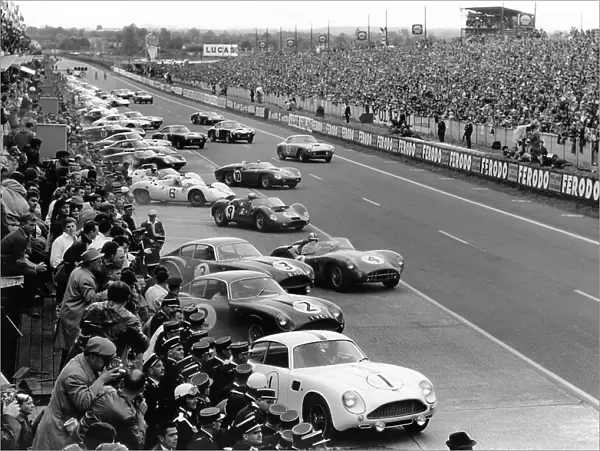 1961 Le Mans 24 hours - Start: The cars and drivers make the traditional LeMans start behind Jean Kerguen  /  Jacques Dewez. Roy Salvadori  /  Tony Maggs