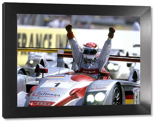 2002 Le Mans 24 hours: Frank Biela  /  Tom Kristensen  /  Emanuele Pirro, 1st position, Pirro takes the chequered flag and salutes a Audi 1st, 2nd and 3rd positions