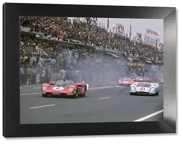 Le Mans, France. 13th - 14th June 1970: L to R: Ignazio Giunti  /  Nino Vaccarella, retired, leads Pedro Rodriguez  /  Leo Kinnunen, retired, ath the start of the race