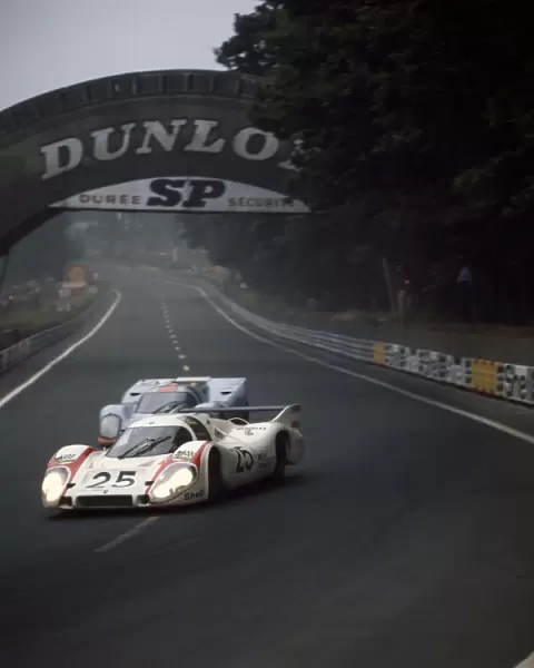 Le Mans, France. 13-14 June 1970: Vic Elford  /  Kurt Ahrens, Porsche 917LH, retired, passes Mike Hailwood  /  David Hobbs, Porsche 917K, retired, action