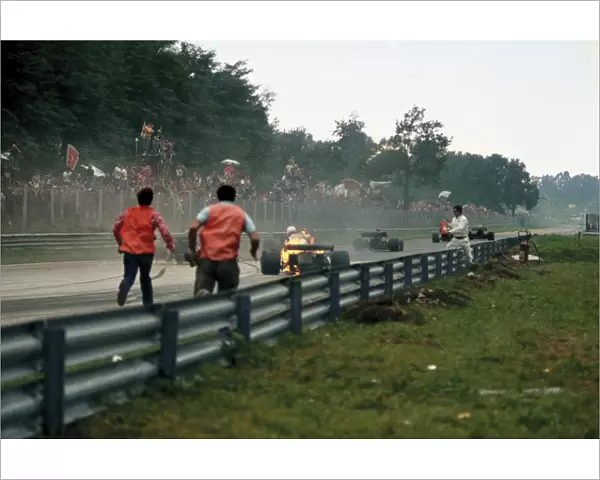 1972 Italian Grand Prix: Clay Regazzoni climbs out of his Ferrari 312B2 after it burst into flames after he came through the Roggia Chicane, action