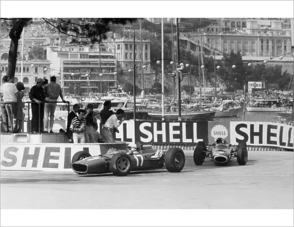 Monte Carlo, Monaco. 22 May 1966: John Surtees, Ferrari 312, retired, leads Jackie Stewart, BRM P261, 1st position, action