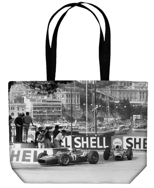 Monte Carlo, Monaco. 22 May 1966: John Surtees, Ferrari 312, retired, leads Jackie Stewart, BRM P261, 1st position, action