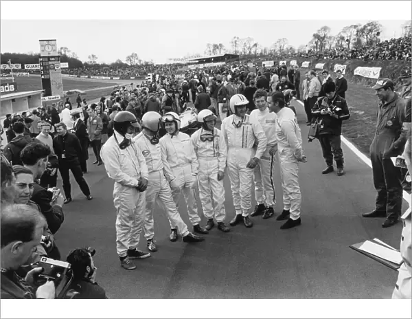 1967 Race Of Champions: L to R: Dan Gurney, Jack Brabham, Bruce McLaren, Richie Ginther, Denny Hulme, Jochen Rindt and Graham Hill share a joke