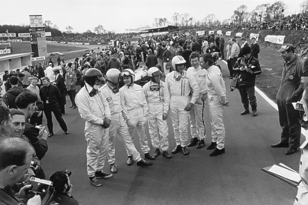 1967 Race Of Champions: L to R: Dan Gurney, Jack Brabham, Bruce McLaren, Richie Ginther, Denny Hulme, Jochen Rindt and Graham Hill share a joke