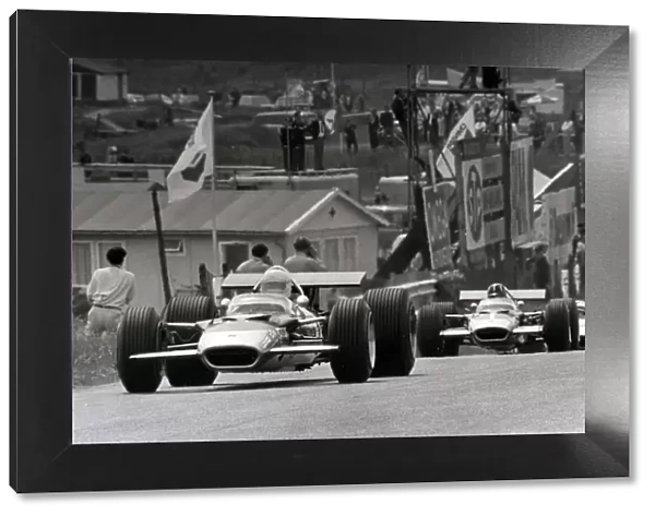 Zandvoort, Holland. 21 June 1969: Jochen Rindt, Lotus 49B-Ford, retired, leads Graham Hill, Lotus 49B-Ford, 7th position, and Jackie Stewart