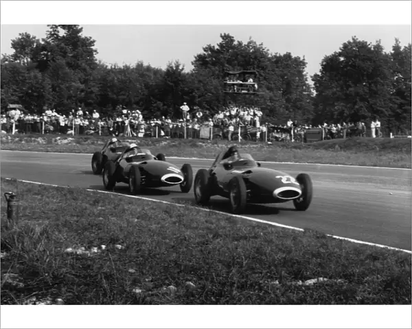 1957 Italian Grand Prix: Stirling Moss, 1st position, chases Tony Brooks, 7th position and is followed by Stuart Lewis-Evans, retired, action