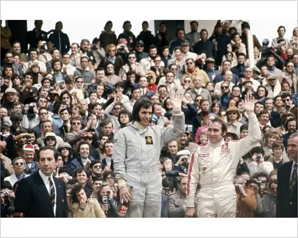 1972 Spanish Grand Prix: Emerson Fittipaldi, 1st position and Clay Regazzoni, 3rd position on the podium, portrait