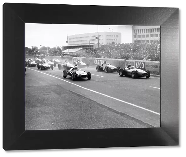 1958 Caen Grand Prix: Stirling Moss, 1st position, leads Jean Behra, retired, at the start, action