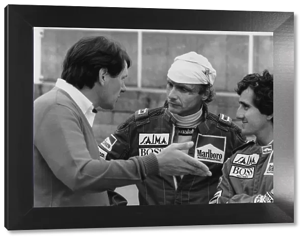1984 British Grand Prix: Brands Hatch, England. 20th - 22nd July 1984. John Barnard in conversation with Niki Lauda 1st position and Alain Prost