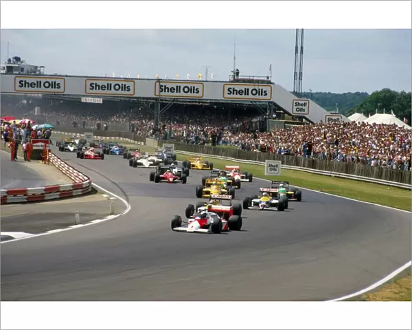 1987 British Grand Prix: Alain Prost leads Nelson Piquet and Nigel Mansell into Copse at the start