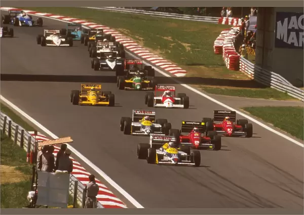1987 Hungarian Grand Prix: Nigel Mansell leads Gerhard Berger and Michele Alboreto, Nelson Piquet, Alain Prost and Ayrton Senna at the start