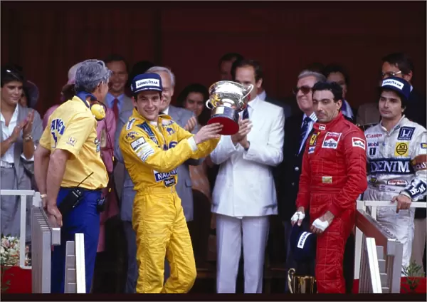 1987 Monaco Grand Prix: Ayrton Senna 1st position, Michele Alboreto 3rd position and Nelsoon Piquet 2nd position on the podium