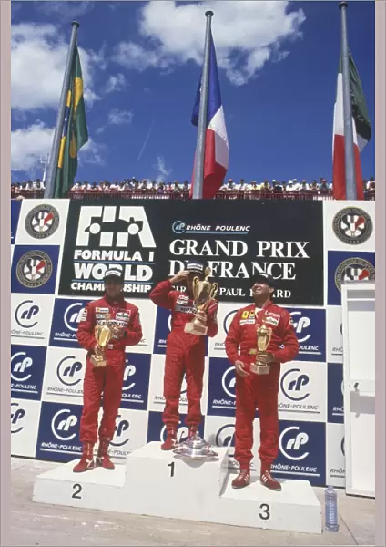 1988 French Grand Prix: Alain Prost, 1st position, celebrates with Ayrton Senna, 2nd position and Michele Alboreto, 3rd position, on the podium