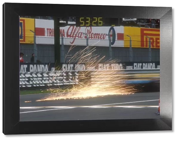 1990 Italian Grand Prix: A benetton B190 Ford sends up a shower of sparks