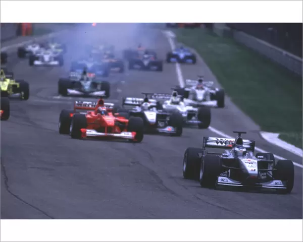 2000 San Marino Grand Prix: Mika Hakkinen, McLaren MP4  /  15 Mercedes, leads away at the start