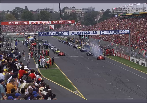 2001 QANTAS AUSTRALIAN GRAND PRIX - Race: Michael Schumacher and Rubens Barrichello lead off from the front row on the parade lap, prior to the start