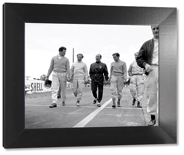 1961 British Empire Trophy: L to R: Tim Parnell, Innes Ireland, Stirling Moss, Jim Clark, Jack Fairman and Lucien Bianchi walk to the start line, portrait