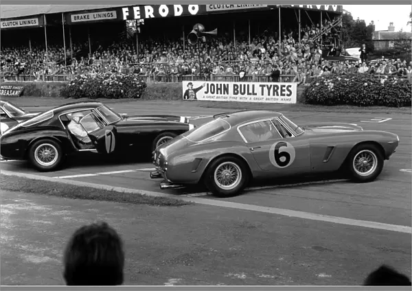1961 RAC Tourist Trophy: Stirling Moss, 1st position, leads Mike Parkes, 2nd position, action