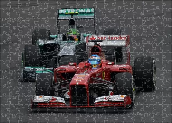 Formula One World Championship: Fernando Alonso Ferrari F138 leads Lewis Hamilton Mercedes AMG F1 W04
