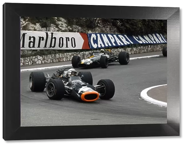 1969 Monaco Grand Prix: John Surtees, B. R. M. P138, retired, leads Jack Brabham, Brabham BT26-Ford, retired, action