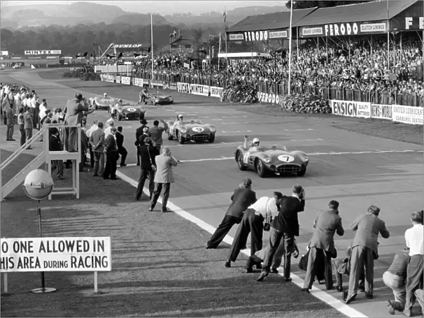 1958 RAC Tourist Trophy: Stirling Moss  /  Tony Brooks, 1st position, leads Jack Brabham  /  Roy Salvadori, 2nd position, across the finish line, action