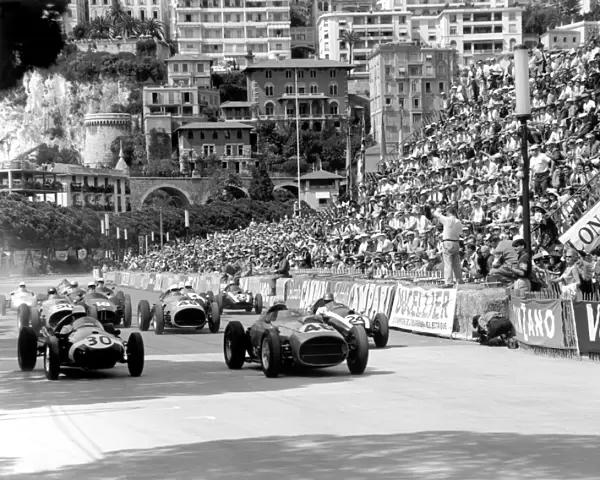 1959 Monaco Grand Prix: Stirling Moss, #30 Cooper T51-Climax, retired, and Jean Behra, #46 Ferrari Dino 246, retired, lead Tony Brooks, #50 Ferrari Dino 246