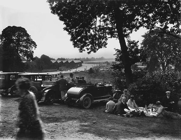 1928 August Bank Holiday Meeting: Cars line up in front of the Vickers sheds as the crowd enjoys a picnic